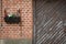 Pot with flowers beside a weathered garage door