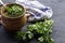 a pot with vats of greens and a towel on a dark background