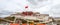 Potala Palace in Lhasa day view from town square with Chinese Red Flag, Tibet Autonomous Region. Former Dalai Lama residence