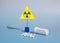 Potassium iodide tablets for use in case of radioactive contamination and radiation sign on a blue background. The name