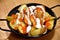Potato bravas casserole, fried with skin, mayonnaise and spicy tomato sauces.