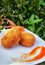 Potato cake dish served with chilli sauce on a white plate