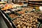 Potato, carrot and other vegetables on boxes at supermarket