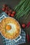 Potato casserole with bolognese. Baked potato casserole with egg and grated cheese in a ceramic oval baking sheet. Wooden dark