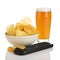 Potato chips, beer and remote control isolated