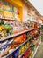 Potato chips and crackers snacks on supermarket shelf