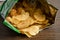 Potato chips, delicious spicy for crips, thin slice deep fried snack fast food in open bag