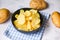 Potato chips snack on bowl, Crispy potato chips on the kitchen table and fresh raw potatoes on table background