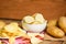 Potato chips snack on white bowl, Crispy potato chips on the table food and fresh raw potatoes on wooden background