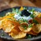 Potato chips with sour cream and black caviar.