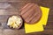 Potato chips,wooden desk and yellow napkins on table, food concept,mock up