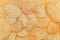 Potato corrugated chips texture background
