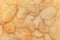 Potato corrugated chips texture background