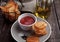 Potato crisps with ketchup on plate and olive oil