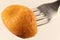 Potato croquette on a fork