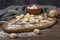 Potato and flour gnocchi, typical Italian pasta on a wooden cutting board with sage leaves