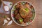 Potato fritters, latkes, draniki, hash browns. Vegetable pancakes on a plate, wooden table.