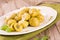 Potato gnocchi stuffed with pesto sauce.