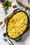 Potato gratin, french cuisine. Healthy casserole or gratin with cream, gratin dauphinois on a gray stone table. Top view flat lay