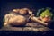 Potato with knife on rustic wooden table , kitchen scene