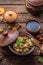 Potato with mushrooms stewed in a clay pot, russian cuisine, rustic style