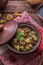 Potato with mushrooms stewed in a clay pot, russian cuisine, rustic style