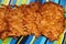 Potato pancakes on a blue striped background