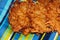 Potato pancakes on a blue striped background