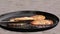 Potato pancakes, fried deep-fried in a pan over an open fire.