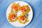 Potato Pancakes With Smoked Salmon. Vegetable fritters with fish. Latkes on a plate