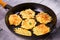 Potato Pancakes. Vegetable fritters. Latkes in frying pan.