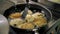 potato patty. potato latkes. cooking. Potato cakes, zrazy. buffet restaurant kitchen. close-up. The cook is flipping