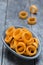 Potato rings on gray rustic wood