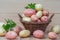 Potato. Ripe potato tubers in a wicker basket on a wooden table