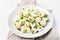 Potato salad with eggs and green onio