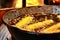 Potato spirals in boiling oil at a street stall