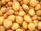 Potato tubes close up on the farm market stall. Food background