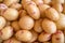 Potato tubes close up on the farm market stall. Food background