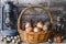The potatoes in the basket,quail eggs, carrots and onions with sunflower oil and the old oil lamp