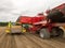 Potatoes being harvested and unloaded into wooden bins on a farm in New Zealand