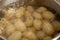 Potatoes boiling in a saucepan. Cooking young potatoes