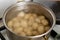 Potatoes boiling in a saucepan. Cooking young potatoes