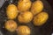 Potatoes boiling in a saucepan on a gas hob