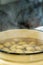 Potatoes Boiling in Water in Yellow Metal Pot