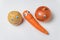 Potatoes, carrots and onion with Googly eyes and on white background. Vegetables with funny faces