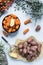 Potatoes on cutting board and carrots in bowl