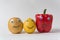 Potatoes, lemon, and bell pepper with funny faces on white background. international friendship concept