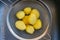 Potatoes peeled in a sieve