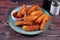 Potatos wedges with tomato sauce served in dish isolated on background side view of fastfood