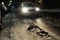 Potholes with car at night
